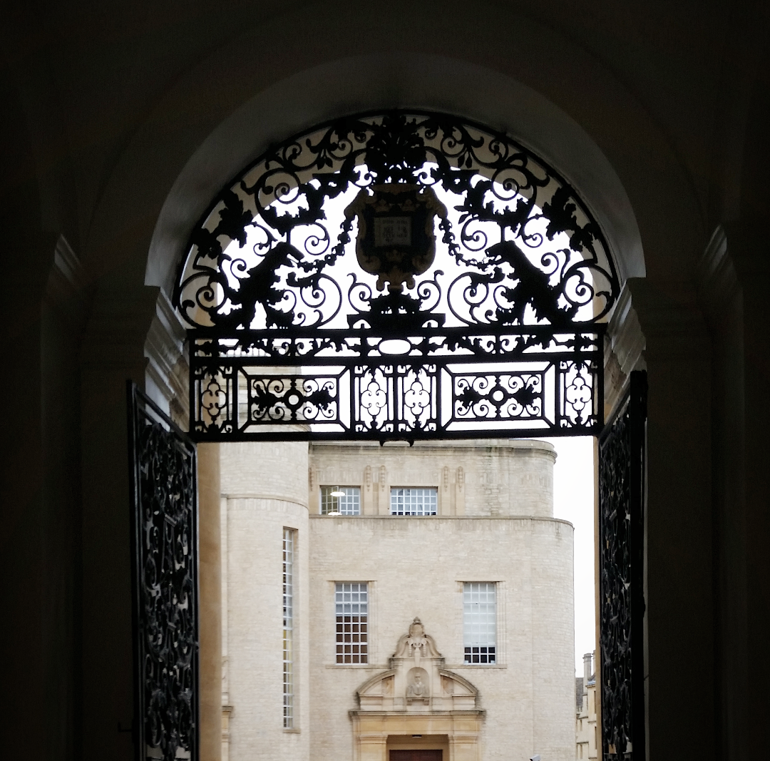 Archway overlooking the Bodleian Library Oxford with ornamental gate  